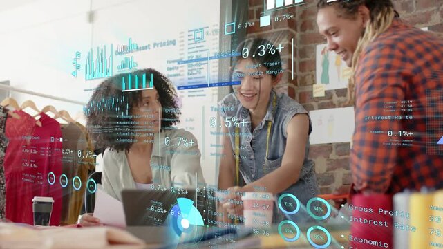 Fashion trio at laptop, designer tapping screen activating data overlays reviewing metrics