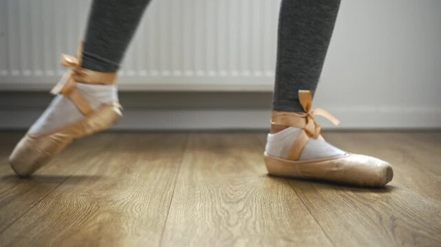 Ballerina Feet Perform Exercises In Pointe Shoes At Barre During A Dance Rehearsal