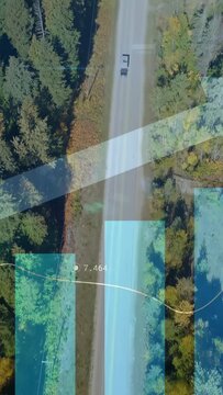 Vertical video: Drone starting truck moving down as dark car passing telemetry showing traffic flow