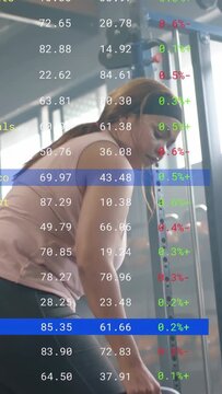 Vertical video: Woman reaching for 5kg KB, doing bent-over row while fitness overlay tracking reps