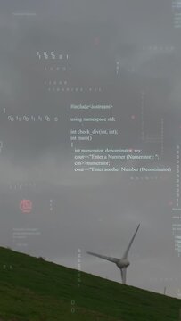 Vertical video: Breeze driving wind turbine turning while camera tilting up, code showing power