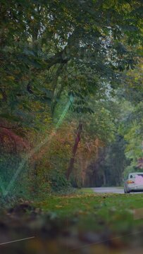 Vertical video: White sedan moving away down road, animated bars sliding aside revealing tech chart