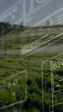 Vertical video: Camera panning showing pivot spraying mist, HUD obscuring field for farm monitoring