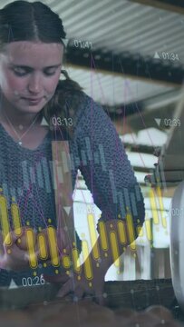 Vertical video: Worker leaning, lifting egg, picking and checking eggs, sorting, packing with HUD