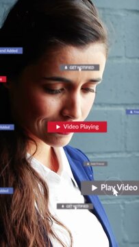 Vertical video: Woman tapping phone, showing play badge, alerts, with yellow mug, checking biz app