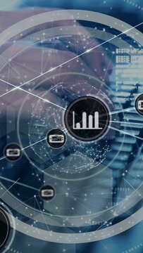 Vertical video: Hands typing keys and activating HUD over keys, nodes and graph showing technology