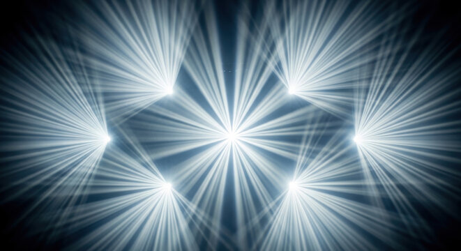 Bright white light beams on dark background