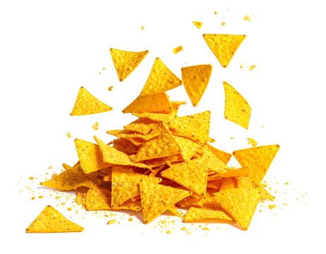 Delicious pile of crispy tortilla chips flying isolated against a white background