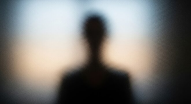 Silhouette of a Person in Front of Light.