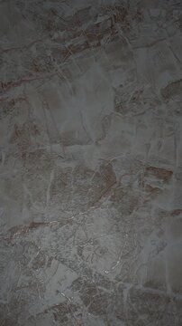 Abstract texture of decorative plaster wall with moving light.