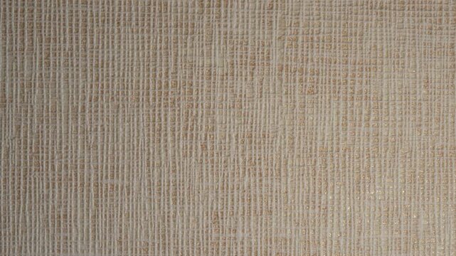 Texture of beige wallpaper with linen fabric pattern and soft light.