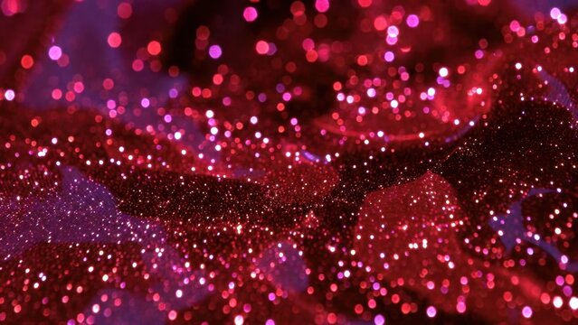 Red bokeh glitter texture across blurred surface closeup
