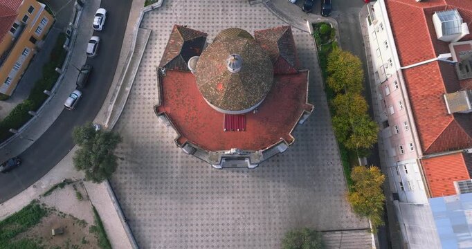 Top down aerial of Santo Amaro Chapel in Alcantara Lisbon near the 25th April Bridge