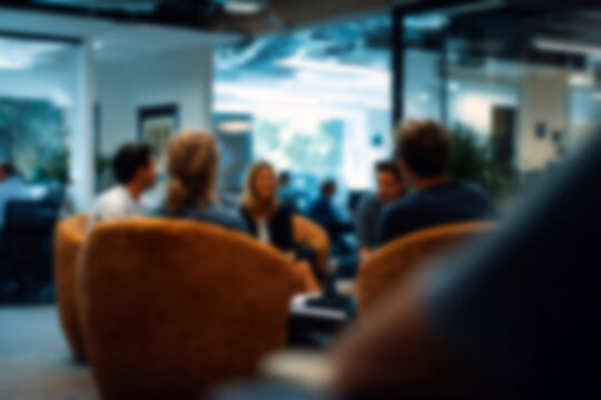 Blurred Diverse business team collaborating in modern office, focused discussion