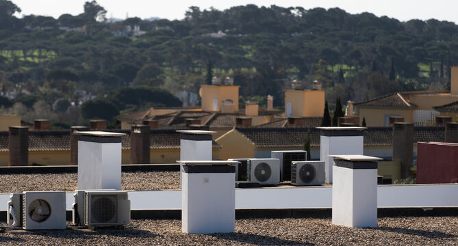 Rooftop hvac units are maintaining a comfortable temperature inside a large building, demonstrating efficient climate control in action