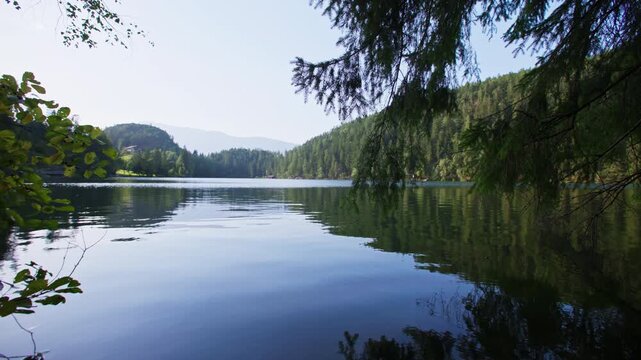 Nature landscape on Piburger See in the Austrian Alps. Beautiful mountain slopes, the lake is surrounded by forests.
