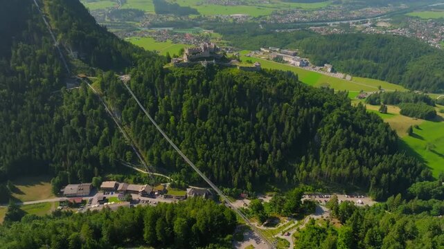 Scenic aerial of Ehrenberg Castle ruins and Highline 179 bridge surrounded by alpine mountains in Austria travel destination