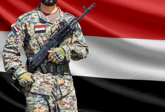 Yemen flag with soldier holding assault rifle