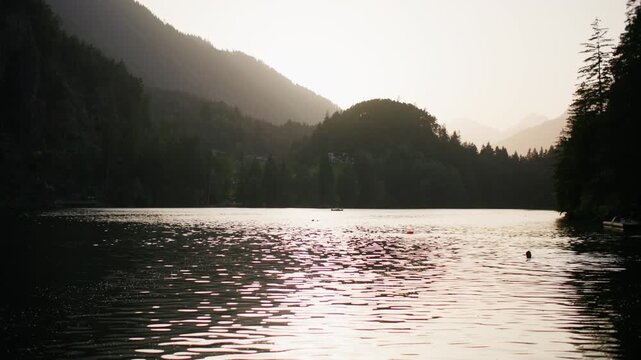 Sunset on Piburger See in the Austrian Alps. Beautiful nature landscape of a lake in a mountain gorge.