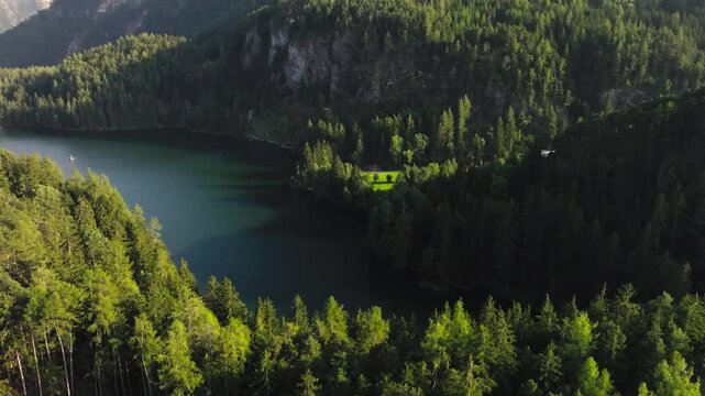 Aerial view of Piburger Lake landscape in Turol Austria. High mountain lake in nature al, mountain forests, travel in Europe.