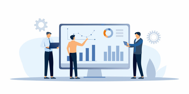 Business professionals analyzing data and charts on a large computer screen