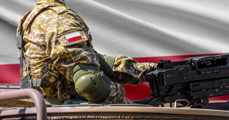 Obraz premium Poland flag with soldier at machinegun turret