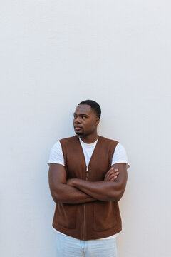Confident african american man posing with crossed arms