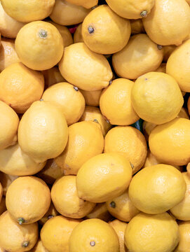 Pile of Fresh Yellow Lemons Background