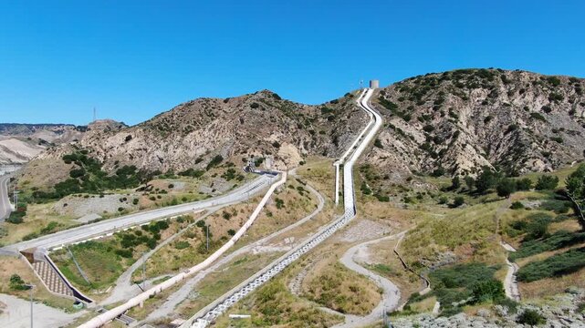 Wide Aerial View of the Los Angeles Aqueduct Cascades and Infrastructure in the Santa Clarita Foothills