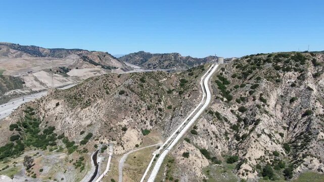 Wide Aerial View of the Los Angeles Aqueduct Cascades and Infrastructure in the Santa Clarita Foothills