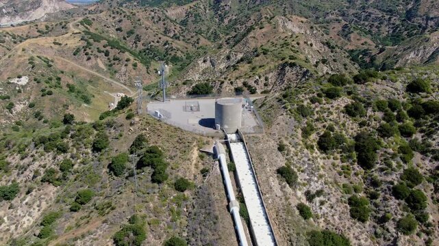 Aerial Drone View of Los Angeles Aqueduct Water Infrastructure and Surge Tank in Santa Clarita, California