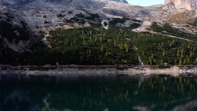 Video drone over Fedaia Lake and Marmolada peak in the Dolomite Alps