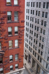 Fototapeta premium Pittsburgh Buildings Show Brick and Stone Design on a Quiet Street During the Day