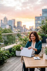 Obraz premium Successful Businesswoman Closing Her Laptop on a Rooftop Terrace at Sunset with City Skyline View