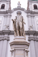 Obraz premium Statue of composer Joseph Haydn in front of the Mariahilfer Church in Vienna.
