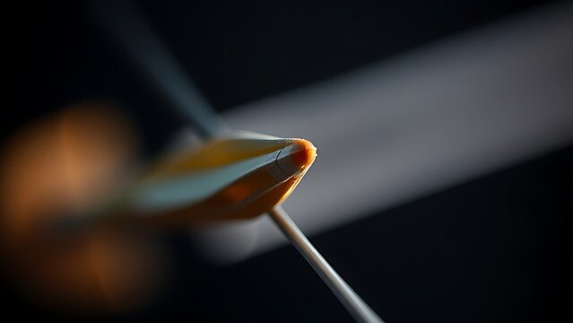 nocked. Close-up of an arrow nocked on a bowstring, dramatic side lighting. event key visuals, club posters, designed for sports event promotions and stadium branding, used by sports marketers.