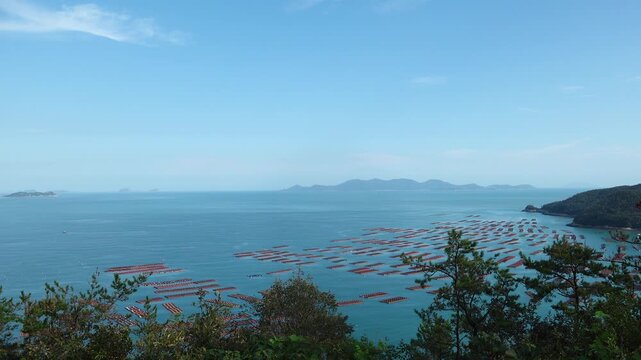 Scenic coastal landscape with abalone farms in the sea of Wando Korea  한국 전라남도 완도 바다의 전복 양식장 풍경