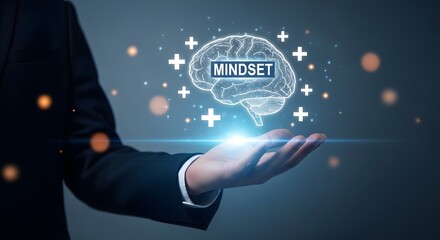 Fototapeta premium Inspiring businessman holding a glowing brain with the word mindset, symbolizing personal growth and positive thinking for success