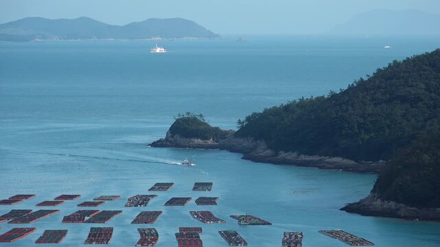 
Scenic coastal landscape with abalone farms in the sea of Wando Korea  한국 전라남도 완도 바다의 전복 양식장 풍경