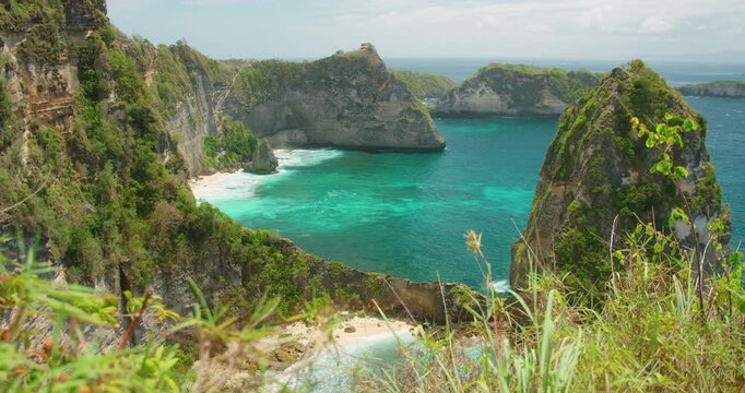 Wide ocean view with rocky islets and clear ocean water in Nusa Penida Island Bali Indonesia