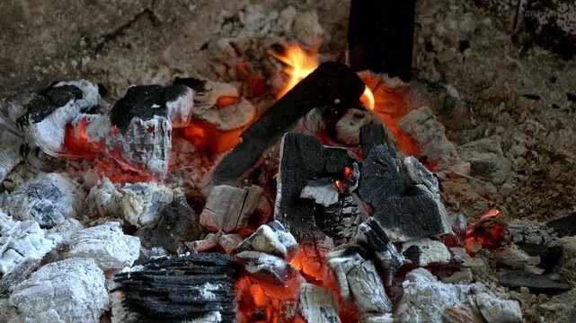 closeup of burning charcoal inside a grill