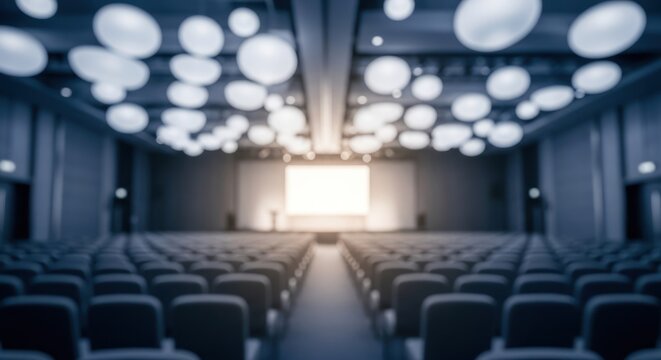 Blurred Empty Conference Hall Interior with Bright Stage