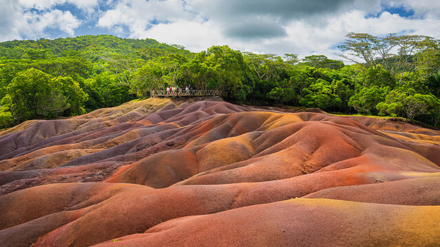 A group of tourists visiting the seven colors earths near Chamarel village in Mauritius