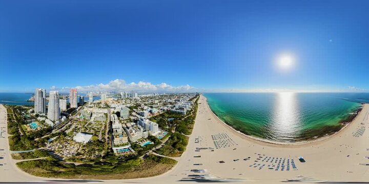 First aerial 360 stock video of Miami Beach. Drone footage view of shoreline and dunes