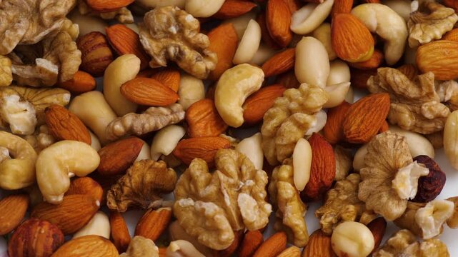 Close-up of mixed nuts assortment including walnuts, almonds, cashews, and hazelnuts. Healthy variety of premium nuts rich in protein and vitamins for a nutritious diet
