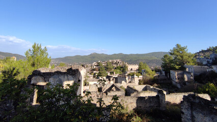 Fototapeta premium kayakoy abandoned village stone houses ruins mountains turkey daylight
