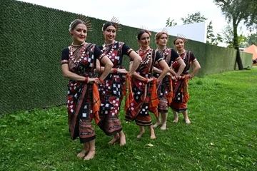 Fotobehang Dansschool Five female dancers in colorful costumes dancing Indian dances in the park  © Шамиль Алиев