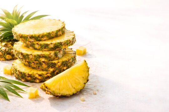 Stack of Fresh Pineapple Slices on Bright Textured Background