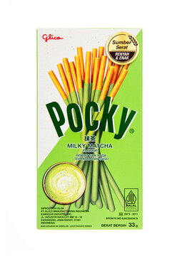 LONDON, UK - DECEMBER 27, 2024: Pocky original biscuit sticks coated with milky matcha on white background.