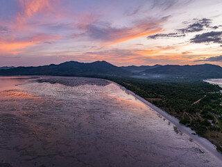 Obraz premium Aerial view of A Peaceful Glow Before the Night. The sky shimmers in gentle hues just before darkness falls, wrapping the horizon in a peaceful glow that feels timeless and pure.